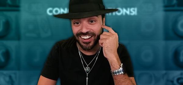man in black hat and t-shirt smiling