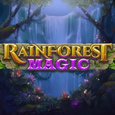 rainforest magic written in yellow and purple letters in front of waterfall
